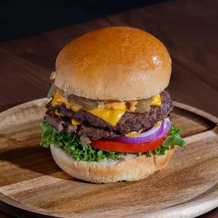 An image of a gourmet burger from Craft Burgers in the Food Hall at Evermore Orlando Resort.