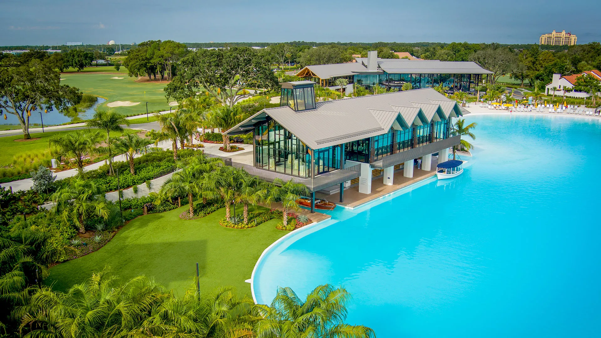 The Boathouse An aerial view of the Boathouse Lawn outdoor event space by The Boathouse and next to Evermore Bay at Evermore Orlando Resort.